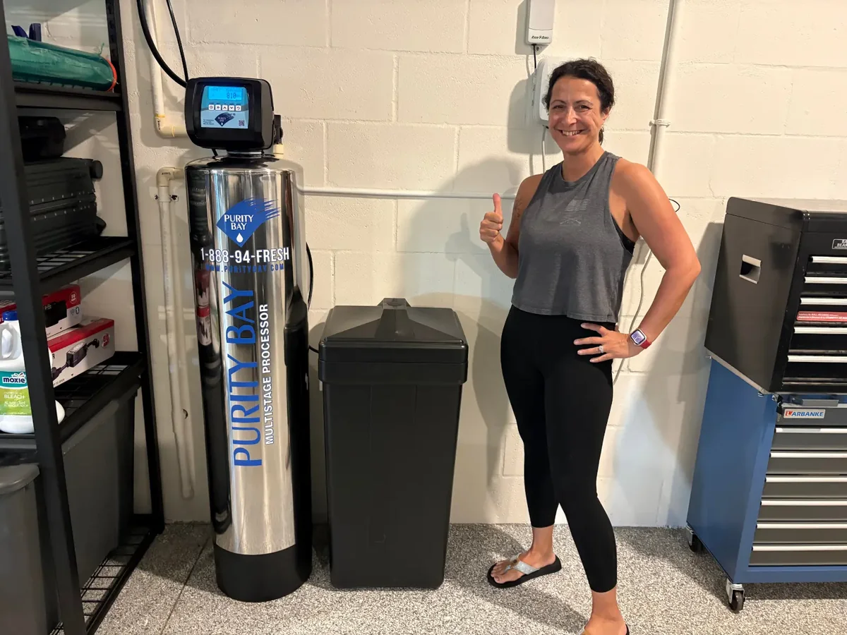 Treasure Island customer beside her Purity Bay system